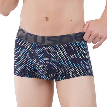 Man wearing patterned underwear on a white background
