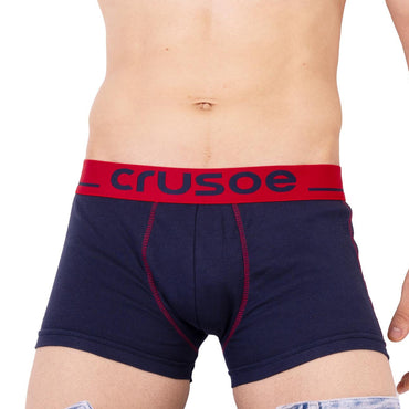 Man wearing navy blue Quest Trunk with red waistband on a white background