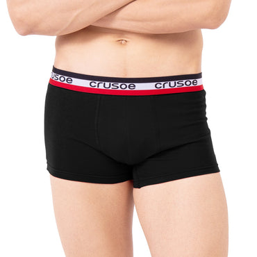 Man wearing black trunk with a visible brand logo on a white background